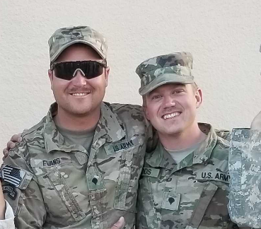 Brett Woods (right) and a National Guard colleague